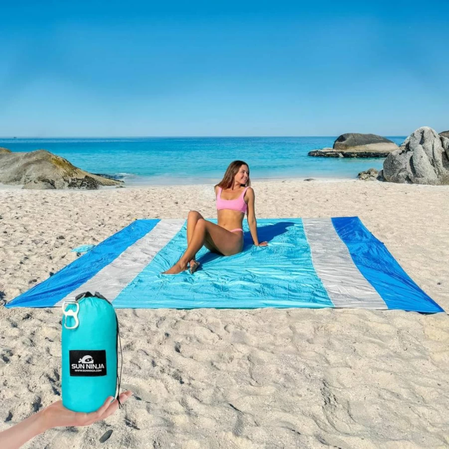 SUN NINJA 10ft x 9ft Sand-Free Beach Blanket with Storage Pouch, Sand Pockets, Stakes, Shoulder Strap & Bottle Opener - Lightweight Portable Outdoor Picnic Mat for Camping, Park, and Travel